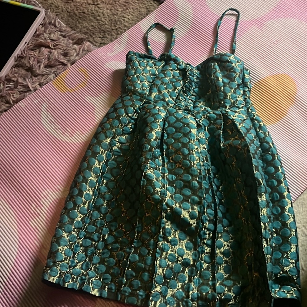 A baby doll styled dress, it is thrifted, barely worn it, small, turquoise, gold